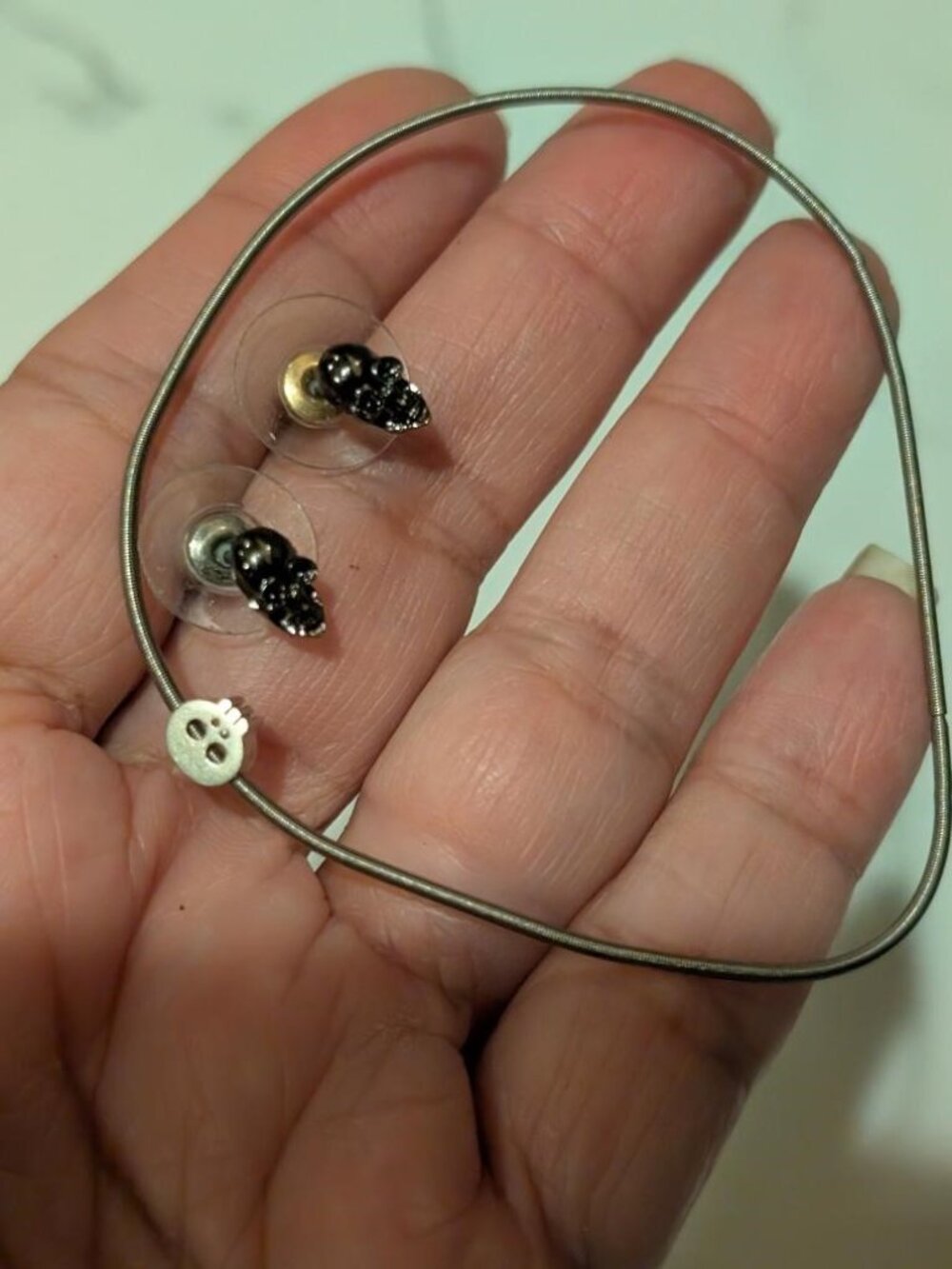 Vintage Halloween Sliver Tone Bracelet with Skull Charm and Stud Skull Earrings.
